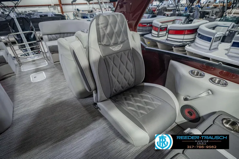 Slide: The Image of Luxurious seating on a 2022 Bennington 23 QXFBA pontoon boat, featuring diamond-stitched upholstery. - 30