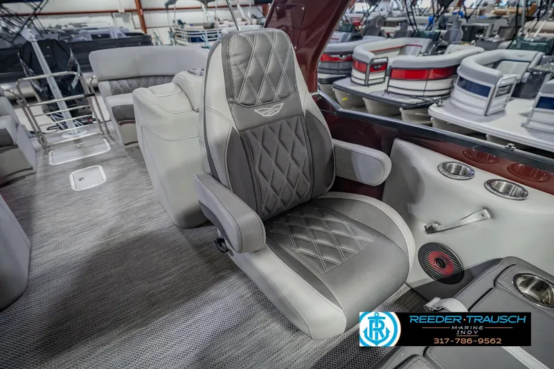 Slide: The Image of Luxurious seating on a 2022 Bennington 23 QXFBA pontoon boat, featuring diamond-stitched upholstery. - 32
