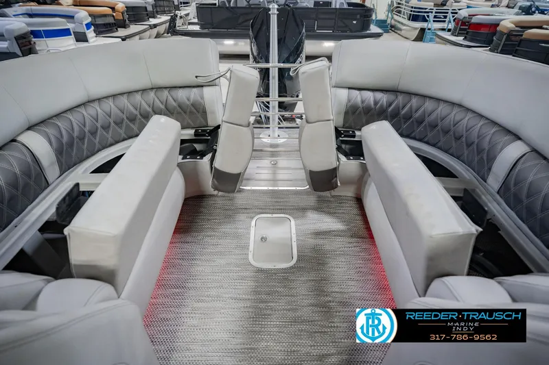 Slide: The Image of 2022 Bennington 23 QXFBA pontoon boat interior with luxurious seating and modern design. - 34