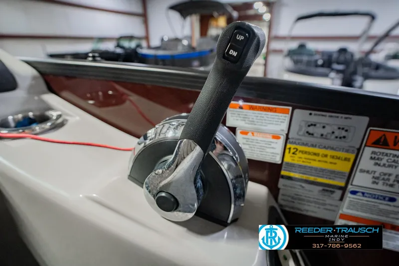 Slide: The Image of Throttle control of a 2022 Bennington 23 QXFBA boat with warning labels visible. - 41