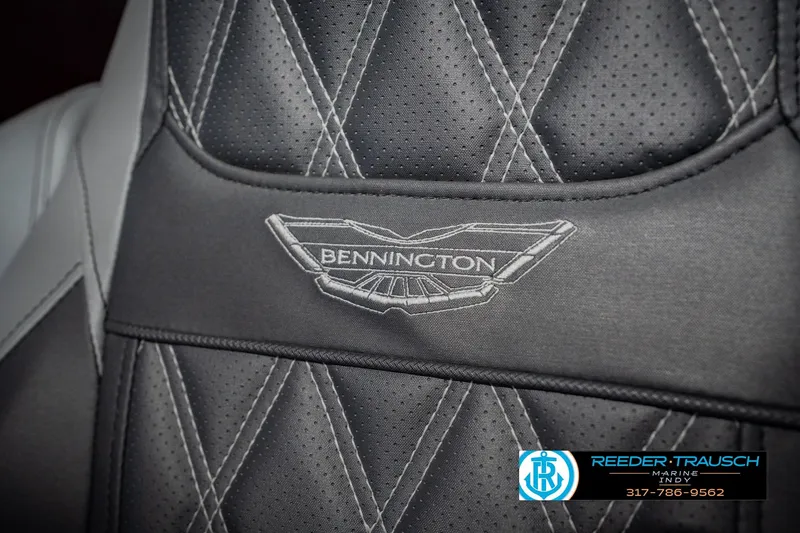 Slide: The Image of Close-up of 2022 Bennington 23 QXFBA boat seat with logo and stitching detail. - 43