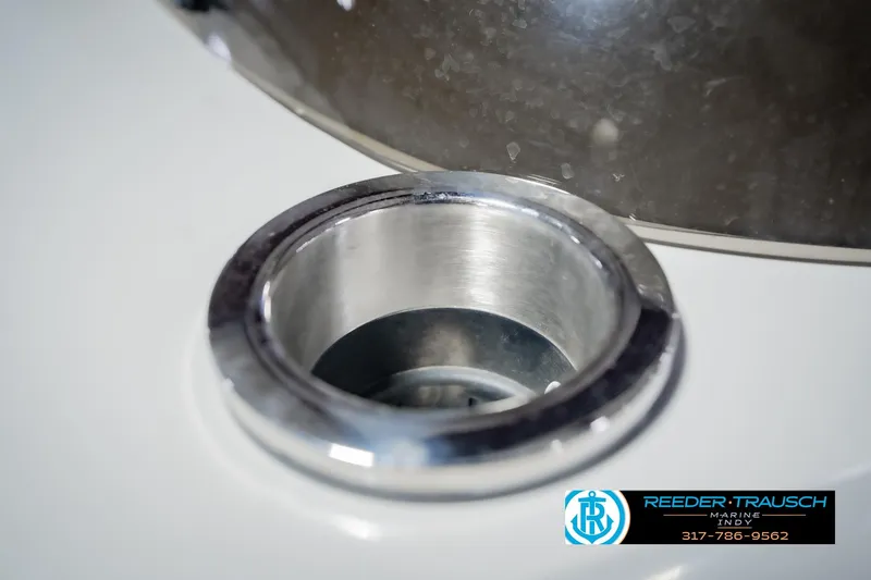 Slide: The Image of Close-up of a 2022 Bennington 23 QXFBA boat's stainless steel cup holder. - 48