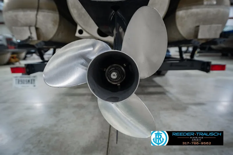 Slide: The Image of Close-up of a 2022 Bennington 23 QXFBA boat propeller in a showroom. - 54