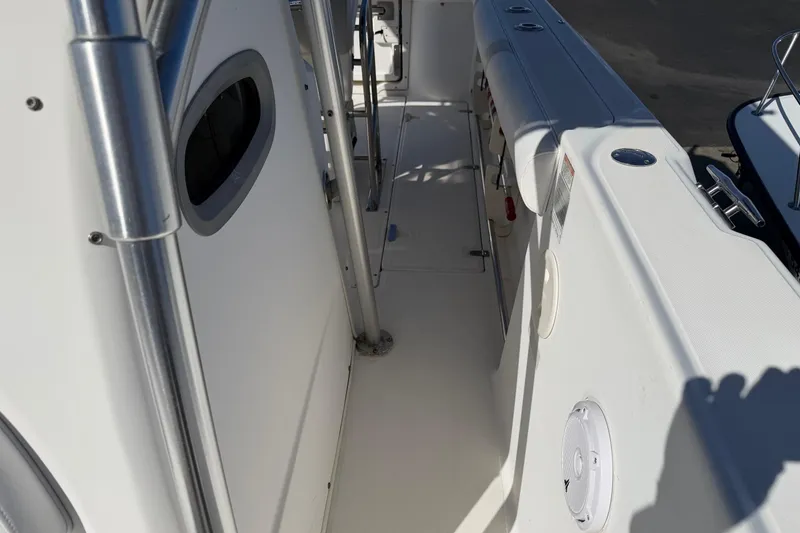 Slide: The Image of 2004 Boston Whaler 270 Outrage boat deck with stainless steel railings. - 11