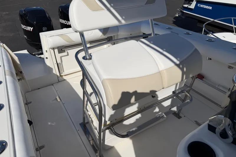 Slide: The Image of 2004 Boston Whaler 270 Outrage boat interior with seating and Mercury engines. - 13
