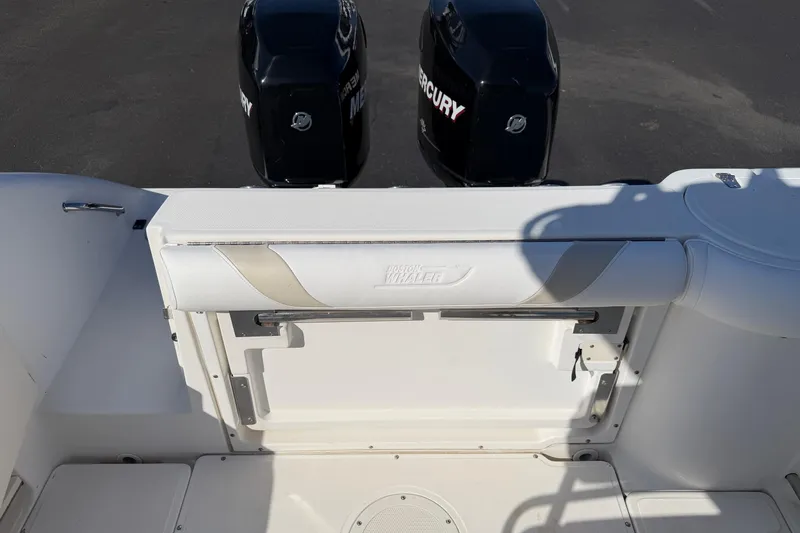 Slide: The Image of 2004 Boston Whaler 270 Outrage boat with dual Mercury engines, rear seating view. - 18