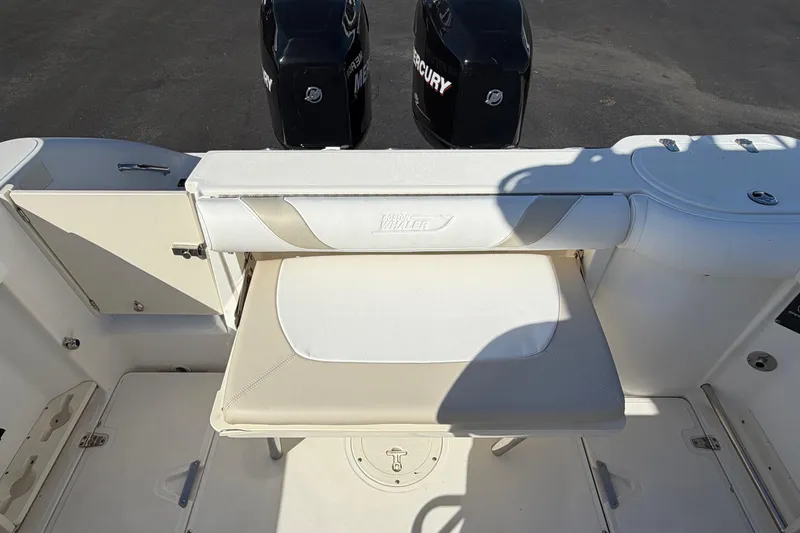 Slide: The Image of 2004 Boston Whaler 270 Outrage boat interior with Mercury engines. - 19