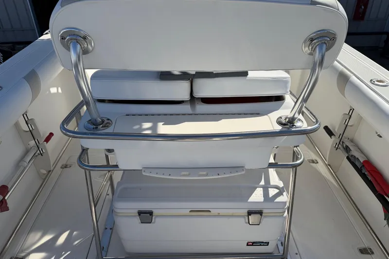 Slide: The Image of 2004 Boston Whaler 270 Outrage boat interior with seating and storage compartments. - 22