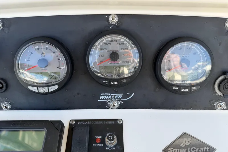 Slide: The Image of Dashboard of a 2004 Boston Whaler 270 Outrage with gauges and SmartCraft system. - 23