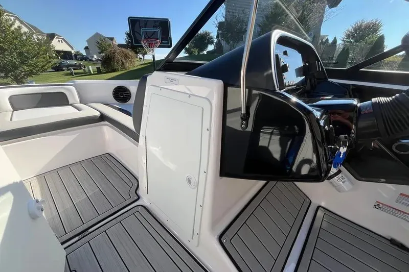 Slide: The Image of 2024 Yamaha Boats 195S interior with sleek dashboard and seating area. - 10