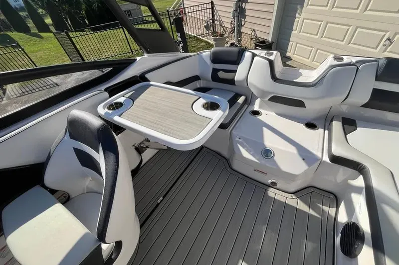 Slide: The Image of 2024 Yamaha Boats 195S interior with seating and table, showcasing modern design and functionality. - 12