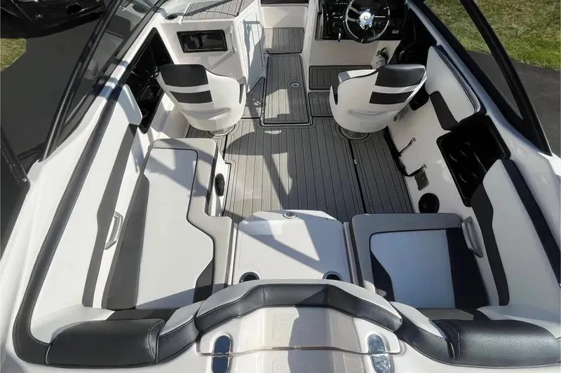Slide: The Image of 2024 Yamaha Boats 195S interior with sleek seating and modern dashboard design. - 15