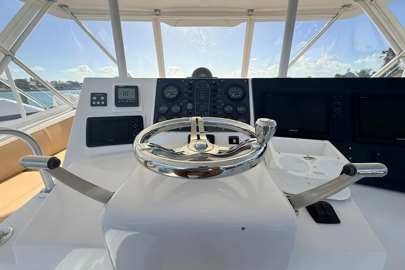 Slide: The Image of Helm of 1992 Viking 50 Convertible yacht with modern navigation instruments. - 10