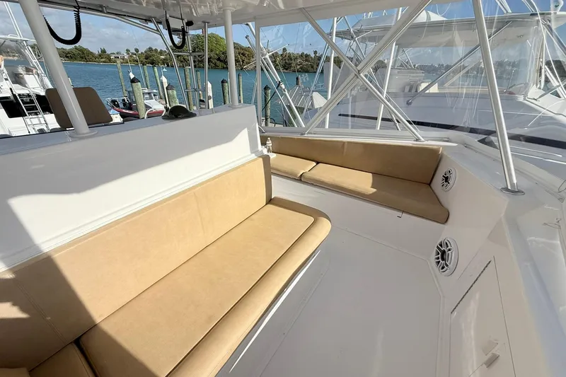 Slide: The Image of 1992 Viking 50 Convertible yacht interior with beige seating and ocean view. - 11