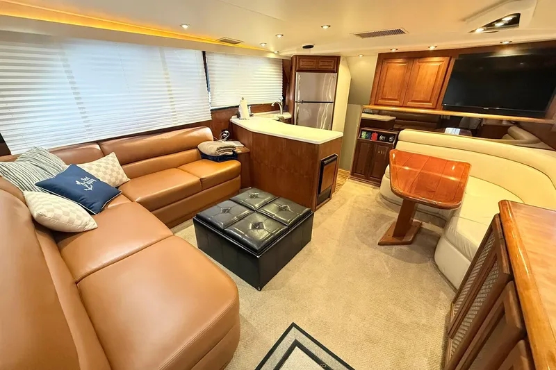 Slide: The Image of Luxurious interior of a 1992 Viking 50 Convertible yacht with leather seating and modern amenities. - 14