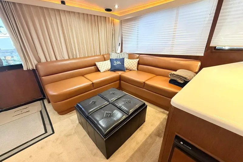 Slide: The Image of Luxurious interior of 1992 Viking 50 Convertible yacht with leather seating and modern decor. - 15
