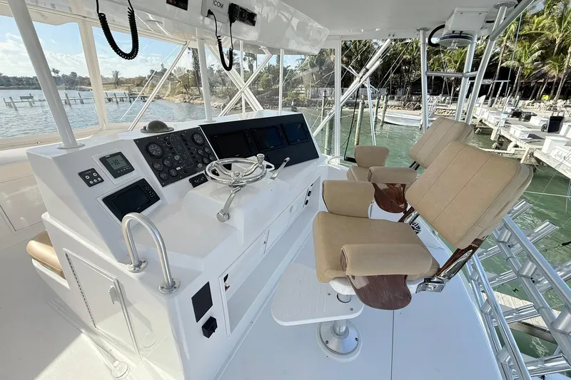 Slide: The Image of Interior helm of 1992 Viking 50 Convertible yacht with control panel and seating. - 2
