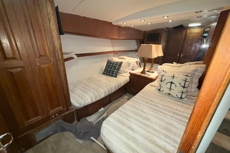 Slide: The Image of Interior cabin of 1992 Viking 50 Convertible yacht with twin beds and nautical decor. - 21
