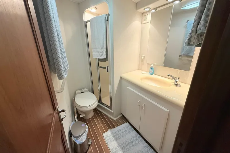 Slide: The Image of Bathroom interior of 1992 Viking 50 Convertible yacht with shower, sink, and toilet. - 26