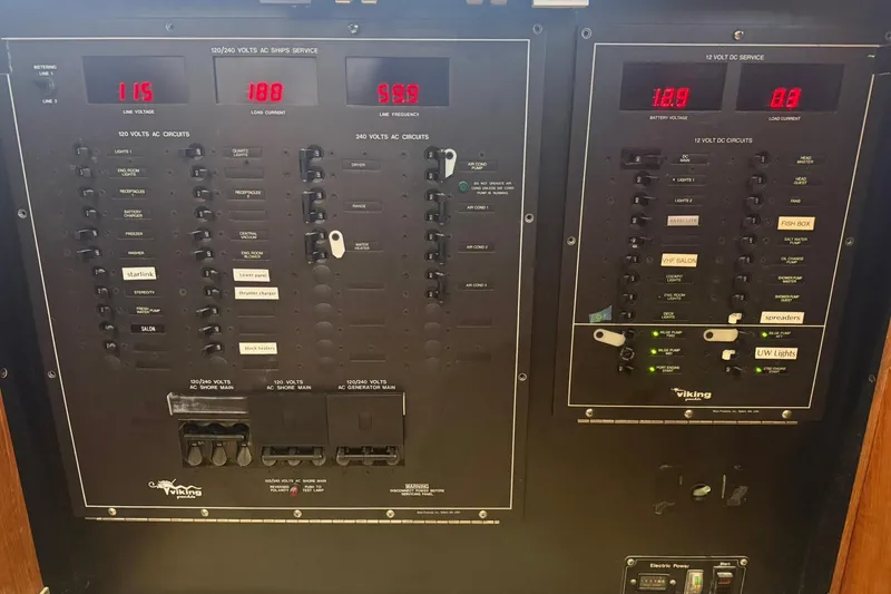 Slide: The Image of Electrical panel of a 1992 Viking 50 Convertible boat, showing voltage and circuit controls. - 27