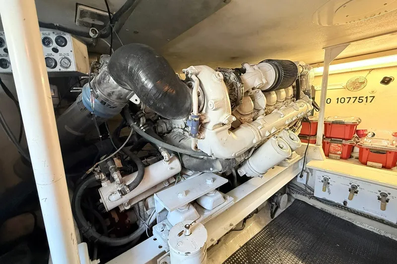 Slide: The Image of Engine room of a 1992 Viking 50 Convertible yacht, showcasing detailed machinery. - 29