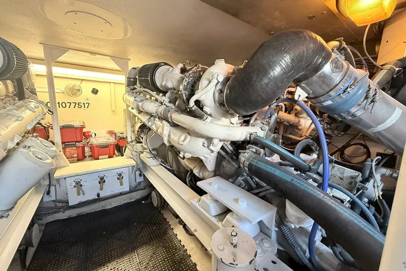 Slide: The Image of Engine room of a 1992 Viking 50 Convertible yacht, showcasing machinery and components. - 30