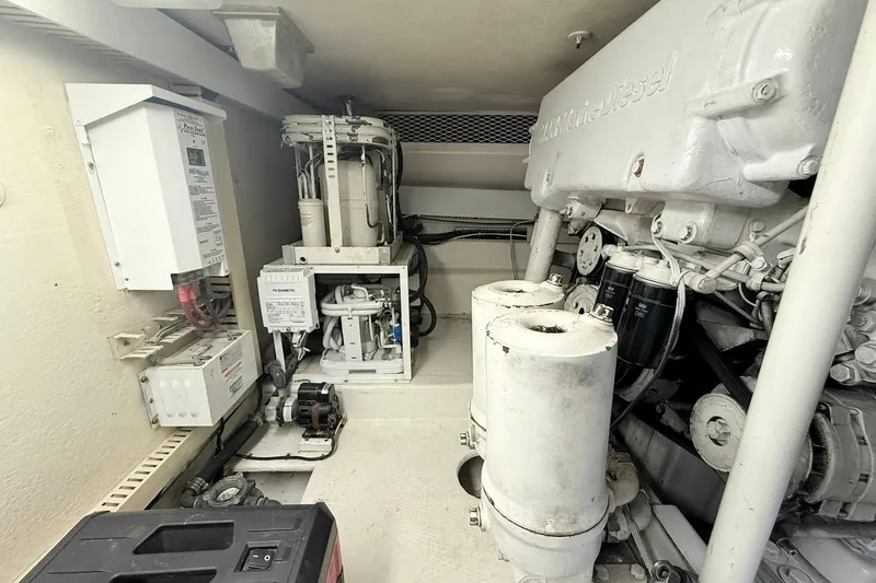 Slide: The Image of Engine room of a 1992 Viking 50 Convertible yacht, showcasing mechanical components. - 32