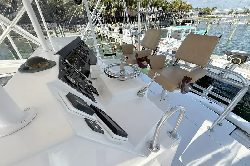 Slide: The Image of Helm of 1992 Viking 50 Convertible yacht with dual captain chairs and control panel. - 6