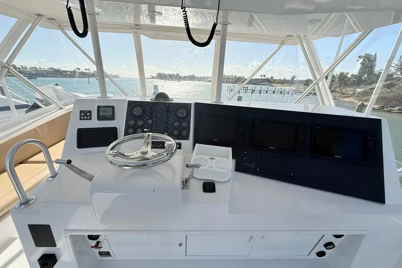 Slide: The Image of Helm of 1992 Viking 50 Convertible yacht with steering wheel and navigation instruments. - 8