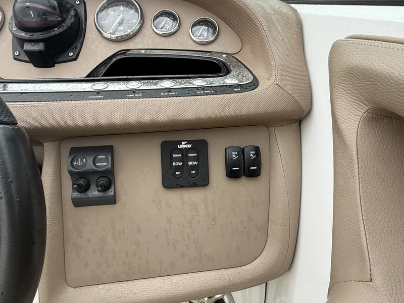Slide: The Image of Dashboard of a 2008 Cobalt 303 boat with controls and gauges. - 10