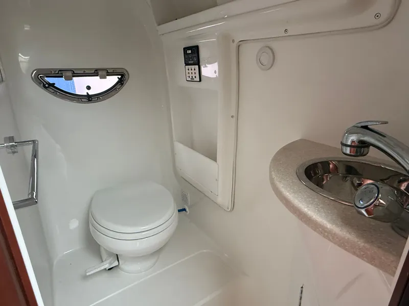 Slide: The Image of Interior of a 2008 Cobalt 303 yacht with leather seating. - 13