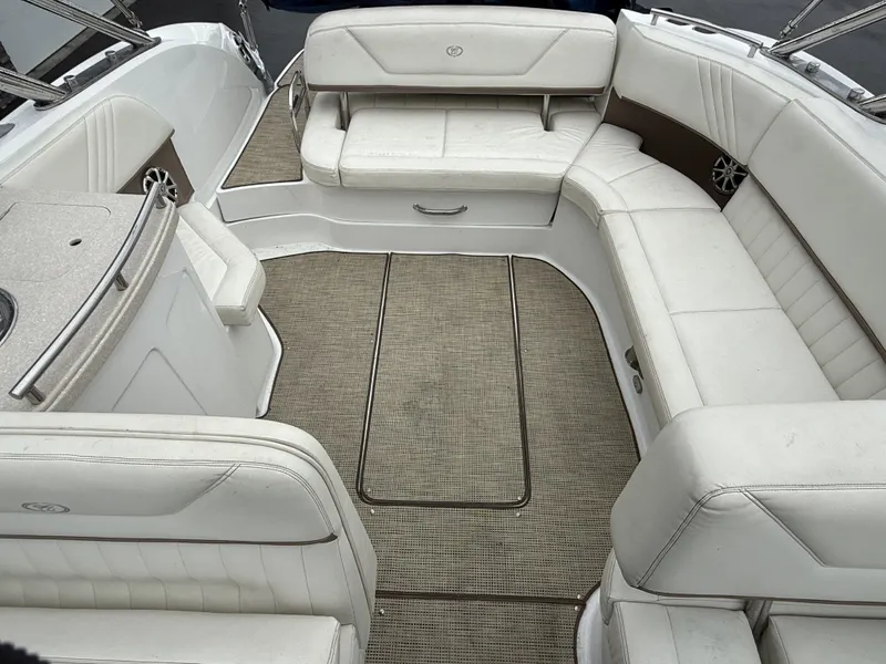 Slide: The Image of Interior of a 2008 Cobalt 303 boat with white leather seating. - 19