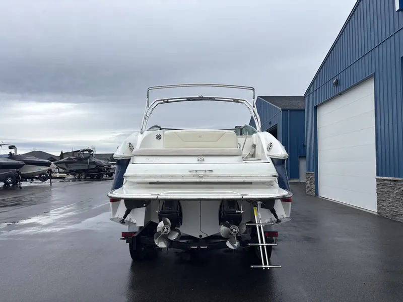 Slide: The Image of Rear view of a 2008 Cobalt 303 boat on wet pavement. - 23