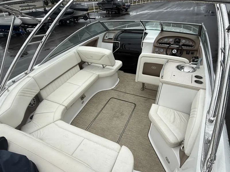 Slide: The Image of Interior of a 2008 Cobalt 303 boat with white seating. - 6