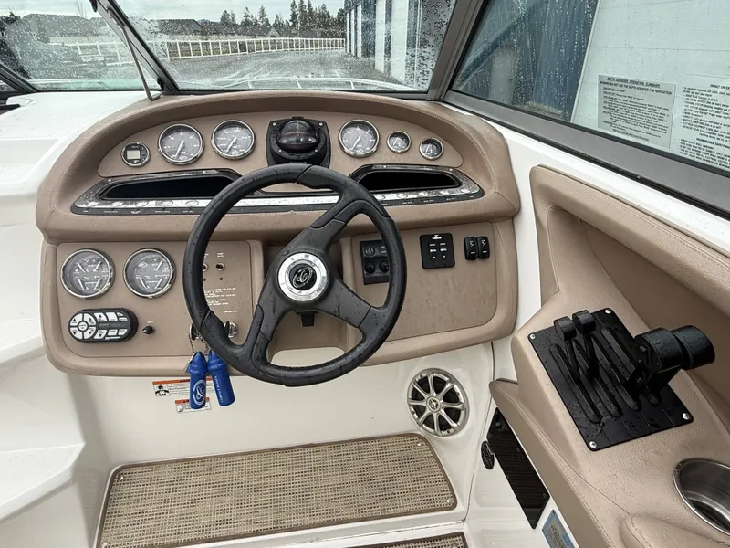 Slide: The Image of 2008 Cobalt 303 boat helm with gauges and controls. - 7
