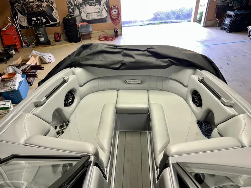 Slide: The Image of Interior of a 2021 Supra SE 450 boat in a garage. - 10