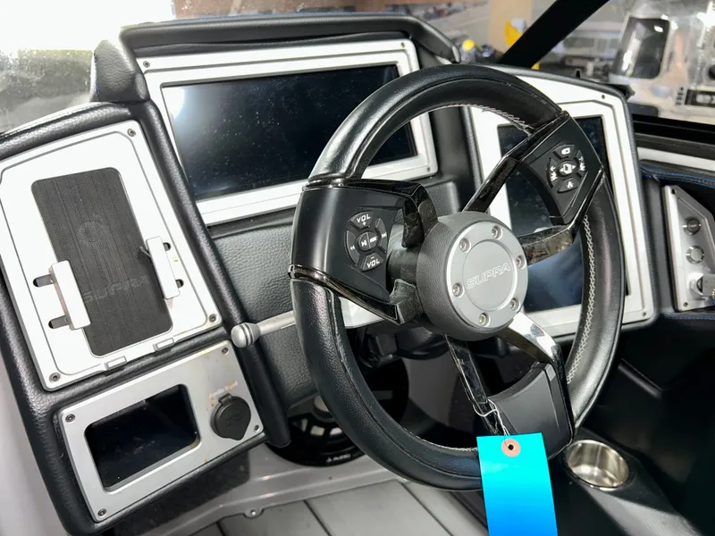 Slide: The Image of Interior of 2021 Supra SE 450 with steering wheel and dashboard. - 13