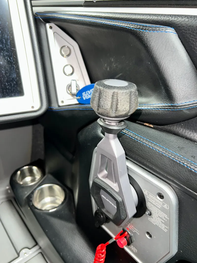 Slide: The Image of Interior of a 2021 Supra SE 450 with gear lever and controls. - 15