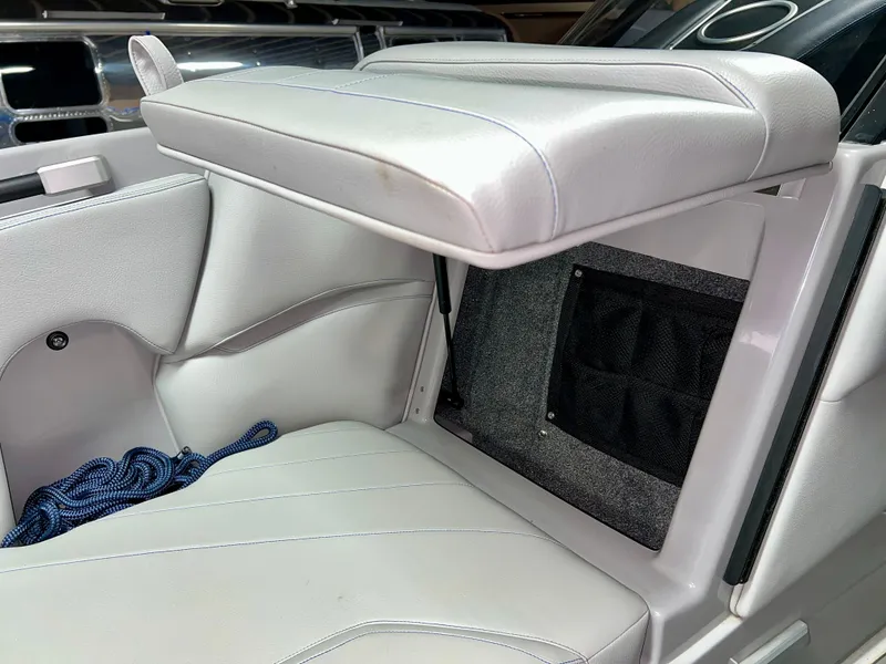 Slide: The Image of Interior of Supra SE 450 boat, seat with storage compartment. - 20