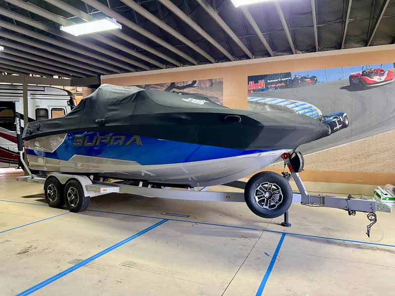 Slide: The Image of 2021 Supra SE 450 boat on trailer in garage. - 3
