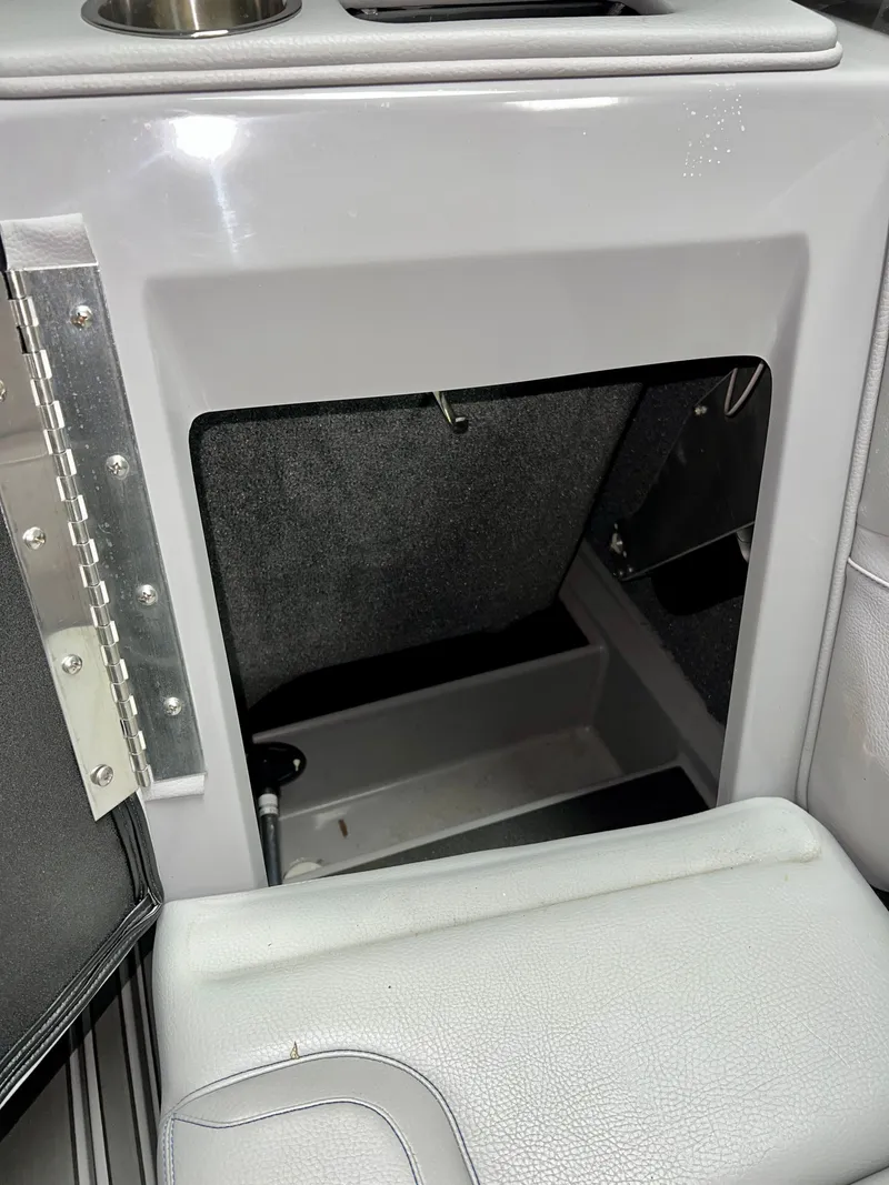 Slide: The Image of Interior of a 2021 Supra SE 450 boat with storage compartment. - 31