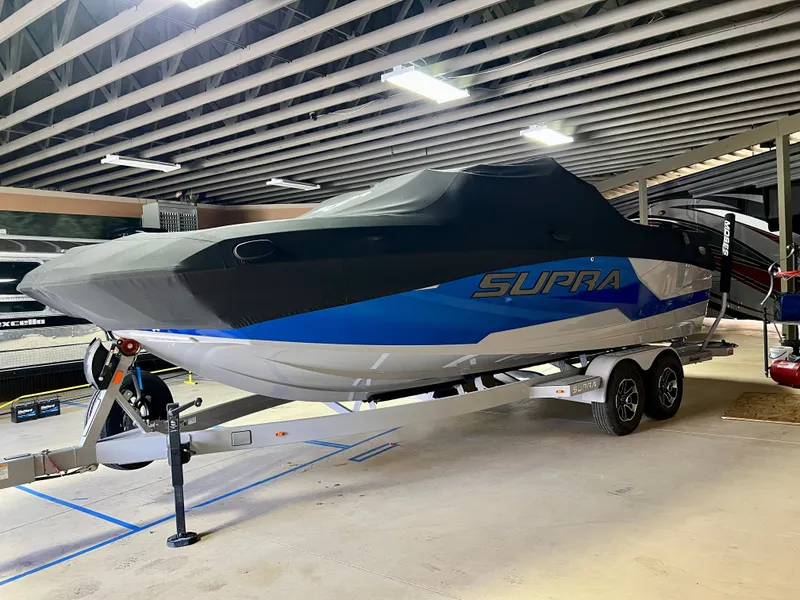 Slide: The Image of 2021 Supra SE 450 boat in warehouse on trailer. - 4