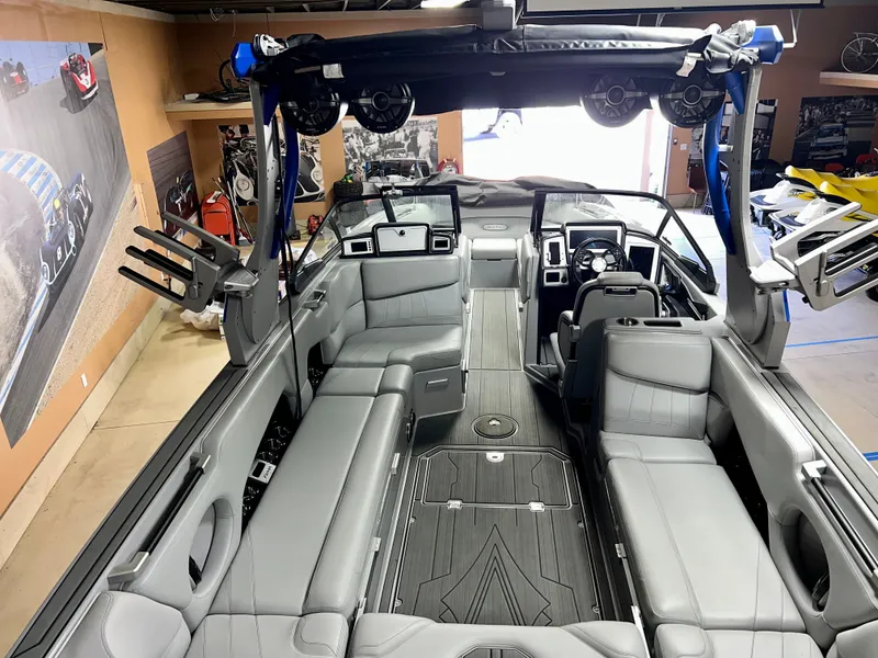 Slide: The Image of Interior of a 2021 Supra SE 450 boat with gray leather seating. - 5