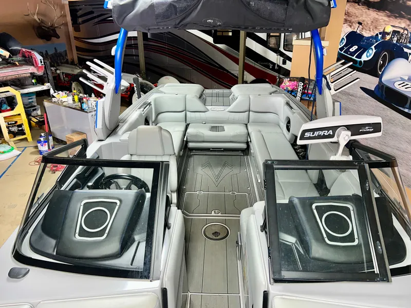 Slide: The Image of Interior view of a 2021 Supra SE 450 boat in a workshop. - 6