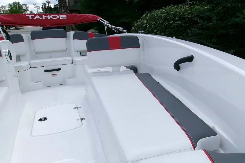 Slide: The Image of 2026 Tahoe T18 boat interior with white and gray seating, red accents, and sleek design. - 4