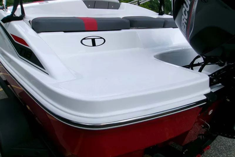 Slide: The Image of 2026 Tahoe T18 boat with sleek design and Mercury engine, featuring red and white accents. - 2