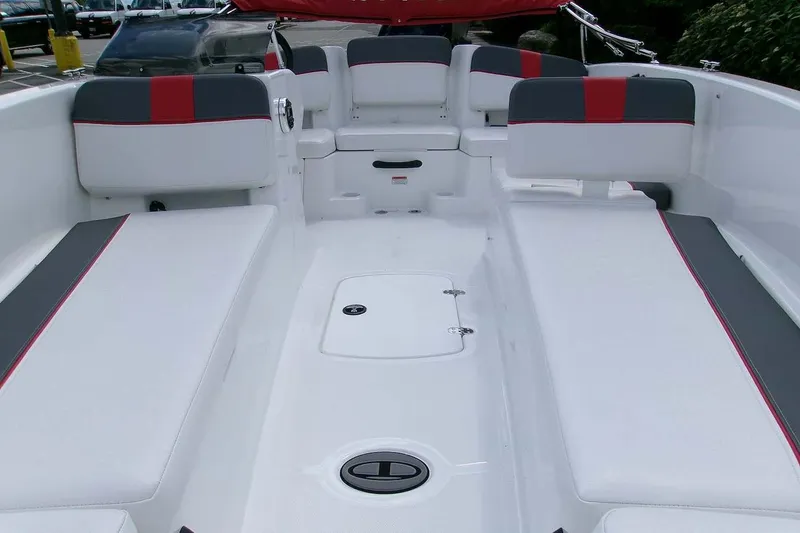 Slide: The Image of 2026 Tahoe T18 boat interior with white and gray seating, red accents, and storage compartments. - 3