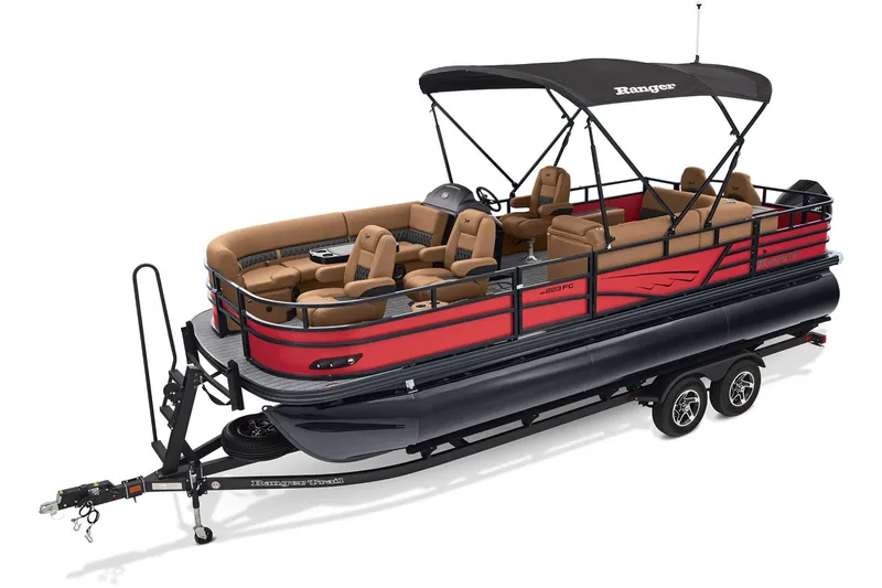 Slide: The Image of 2026 Ranger 223FC boat with outboard motor, parked on a concrete driveway. - 2