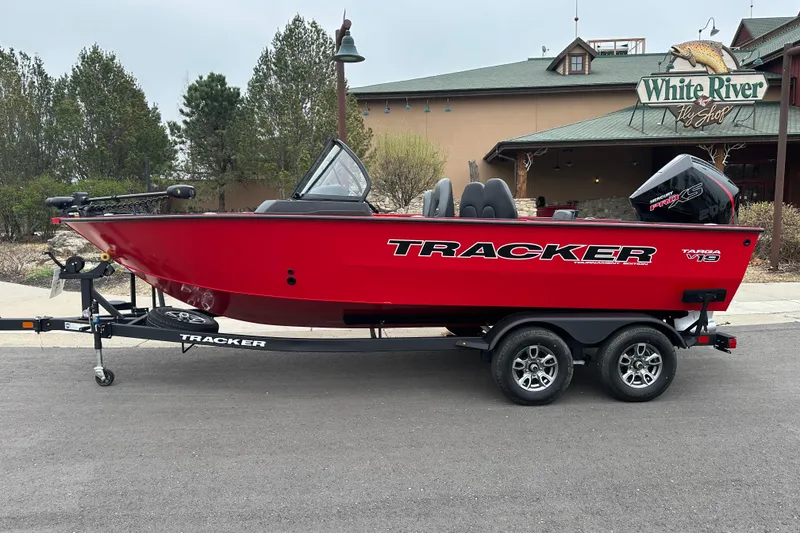 The Image of 2026 Tracker Targa V-19 Combo boat in vibrant red on a trailer. - 0
