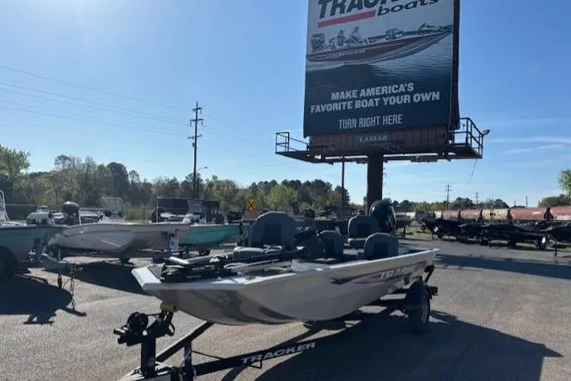 The Image of 2026 Tracker Pro 170 boat on display under a large Tracker Boats billboard. - 0